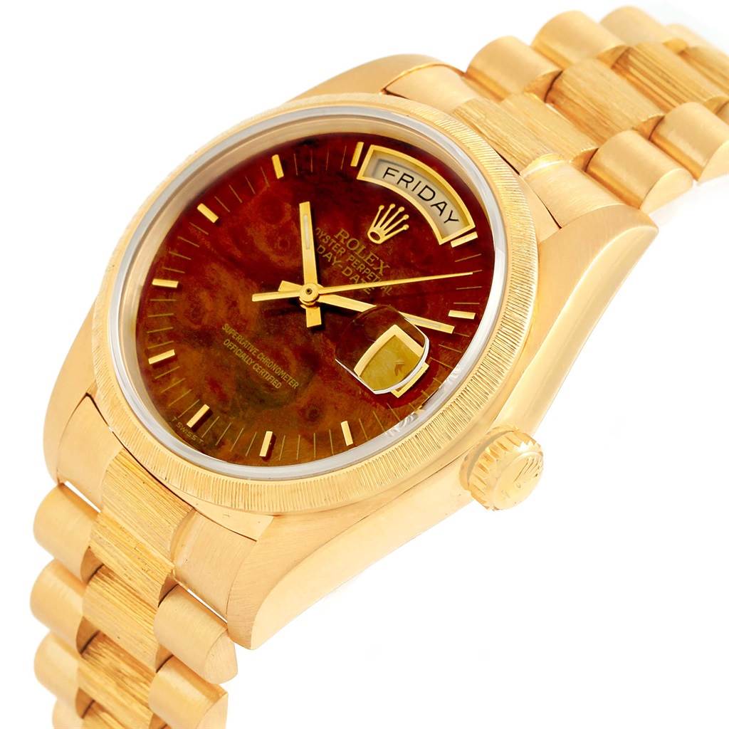This image shows a Rolex President 18078 Men's Yellow Gold Brown Dial 18078 Men's Yellow Gold Brown Dial model watch at an angle highlighting the dial, bracelet, crown, and weekday window.