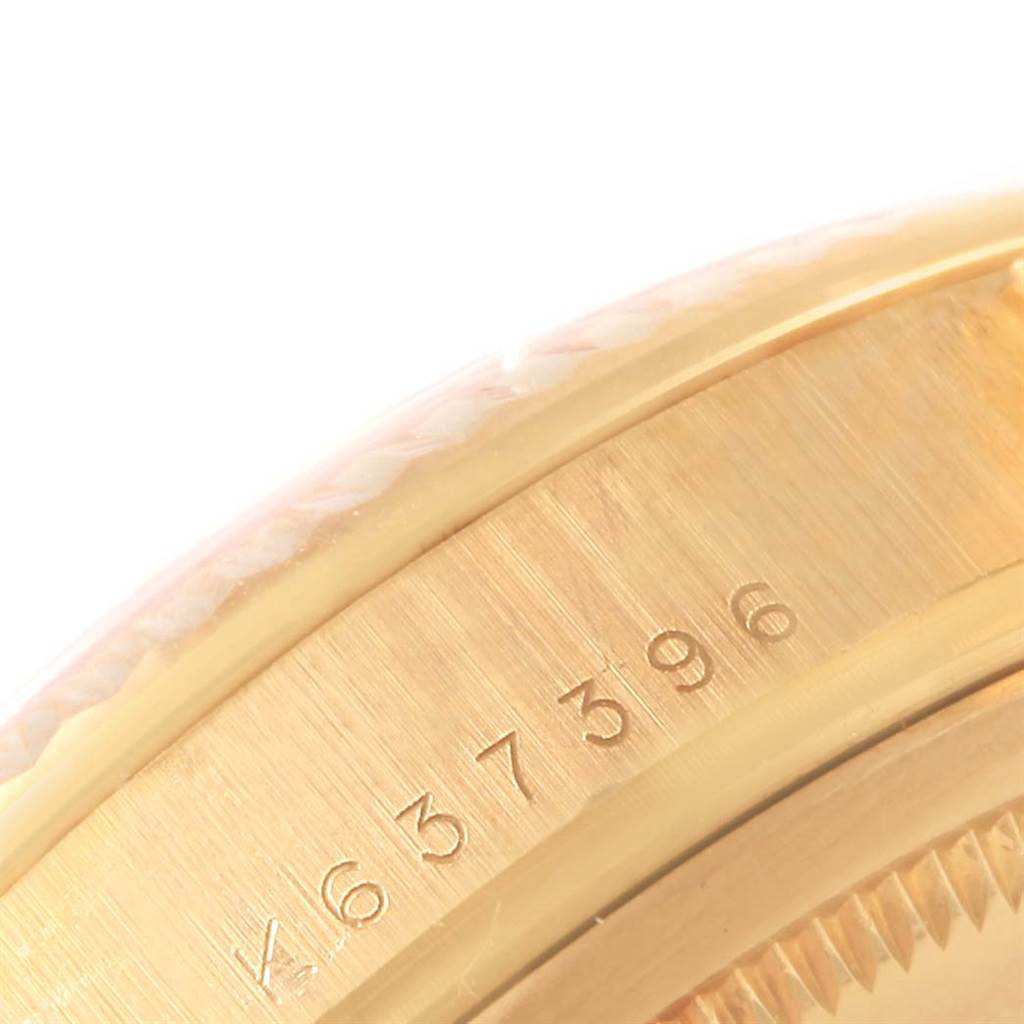 This image shows a close-up of the serial number on the gold case of a Rolex President 118238 Men's Yellow Gold Blue Dial 118238 Men's Yellow Gold Blue Dial model watch.