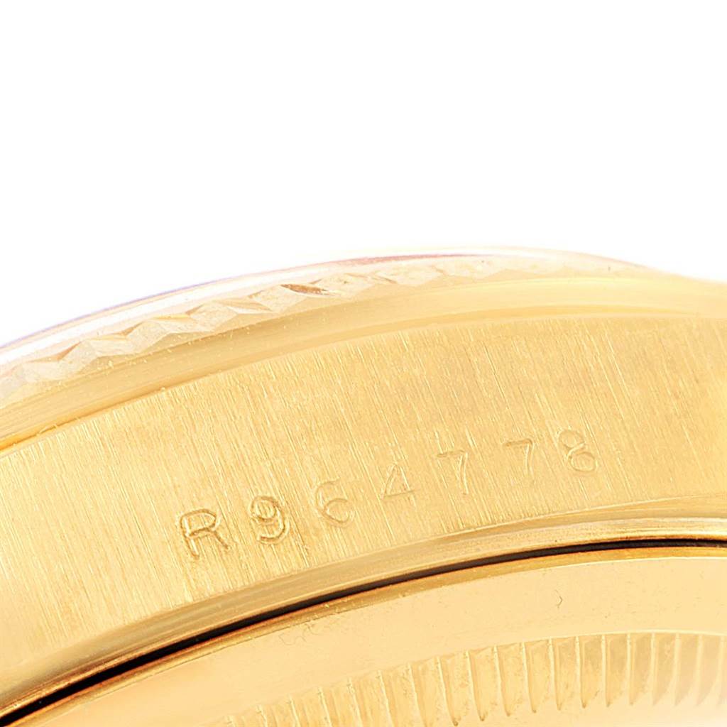 This close-up image showcases the case edge and part of the serial number of a Rolex President 18238 Men
s Yellow Gold Champagne Dial 18238 Men
s Yellow Gold Champagne Dial model watch.