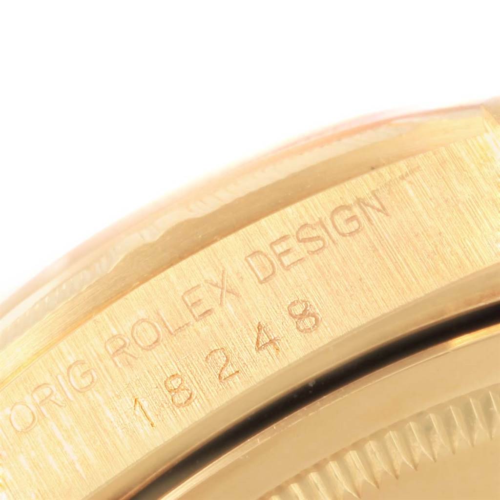 This close-up shows the side engraving on the case of a Rolex President 18248 Men
s Yellow Gold Champagne Dial 18248 Men
s Yellow Gold Champagne Dial model watch.