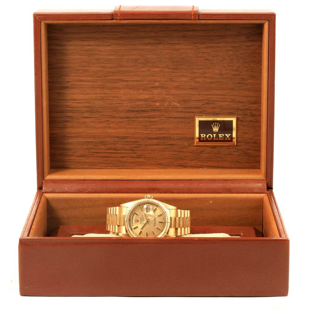 The image shows a Rolex President 18248 Men
s Yellow Gold Champagne Dial 18248 Men
s Yellow Gold Champagne Dial model watch inside an open wooden Rolex box.