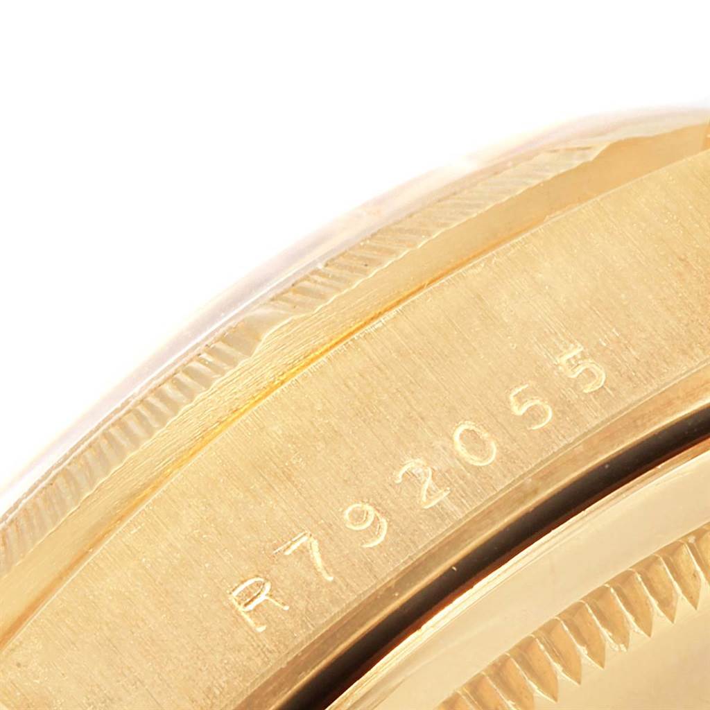 This close-up image shows the side engraving on the case of a Rolex President 18248 Men
s Yellow Gold Champagne Dial 18248 Men
s Yellow Gold Champagne Dial model watch.