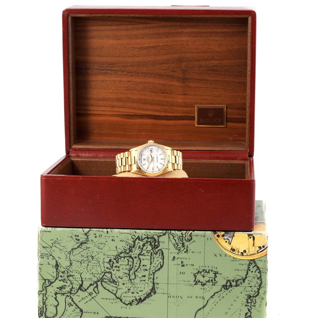 The image shows a Rolex President 18238 Men
s Yellow Gold White Dial 18238 Men
s Yellow Gold White Dial model watch with a gold band, displayed in an open wooden and leather box, viewed from the front.