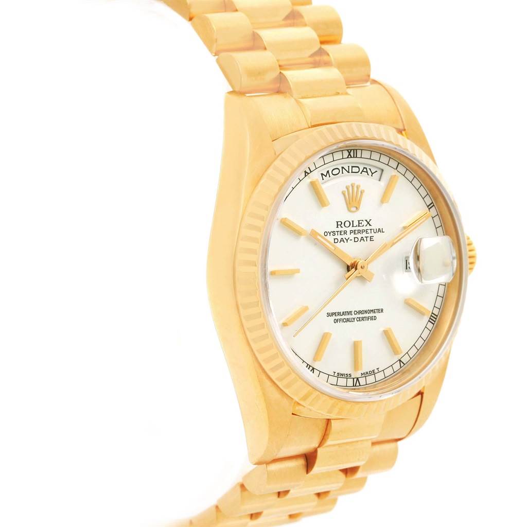 The image shows a side angle of the Rolex President 18238 Men
s Yellow Gold White Dial 18238 Men
s Yellow Gold White Dial Day-Date watch, highlighting its band, face, and date magnifier.