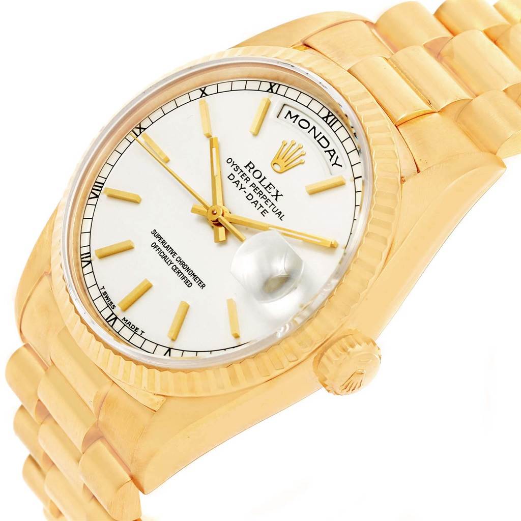 The Rolex President 18238 Men
s Yellow Gold White Dial 18238 Men
s Yellow Gold White Dial model watch is shown at an angled close-up, displaying its gold case, day-date dial, bezel, and bracelet.