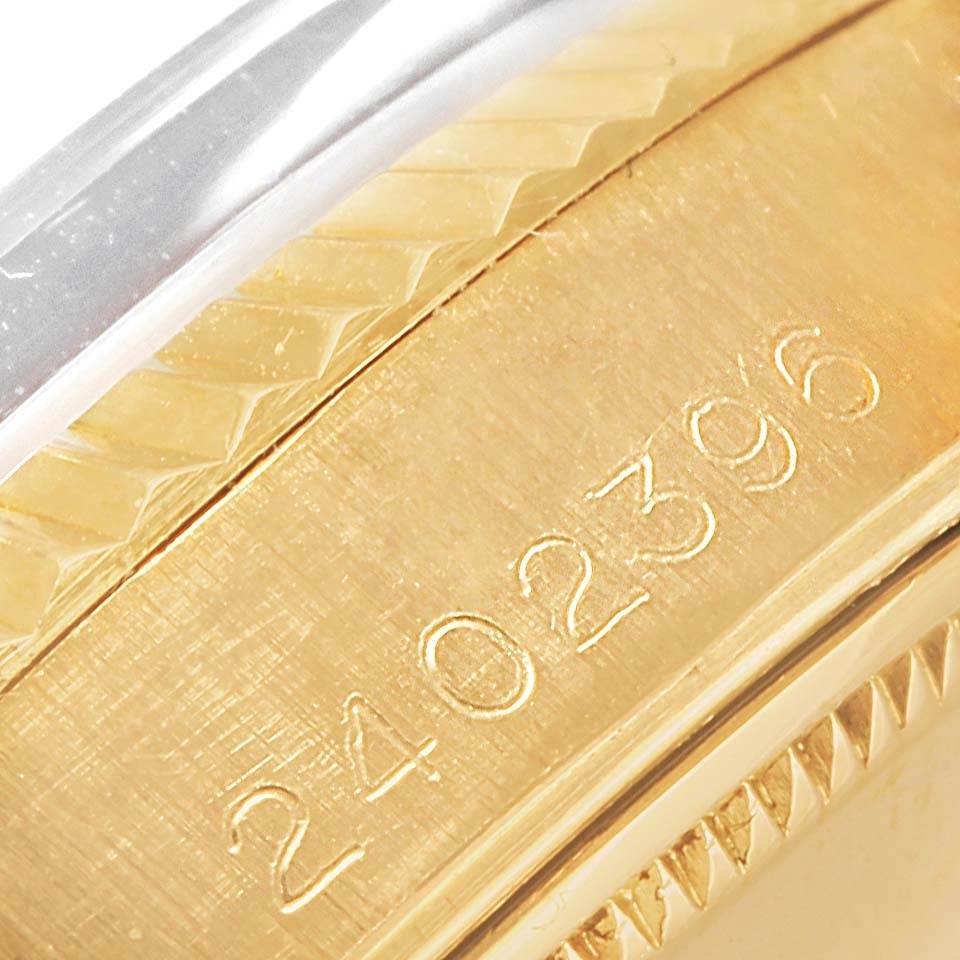 The image shows a close-up of the side of a Rolex President 1503 Men's Yellow Gold Champagne Dial 1503 Men's Yellow Gold Champagne Dial model, highlighting the serial number engraved on the gold part of the watch case.