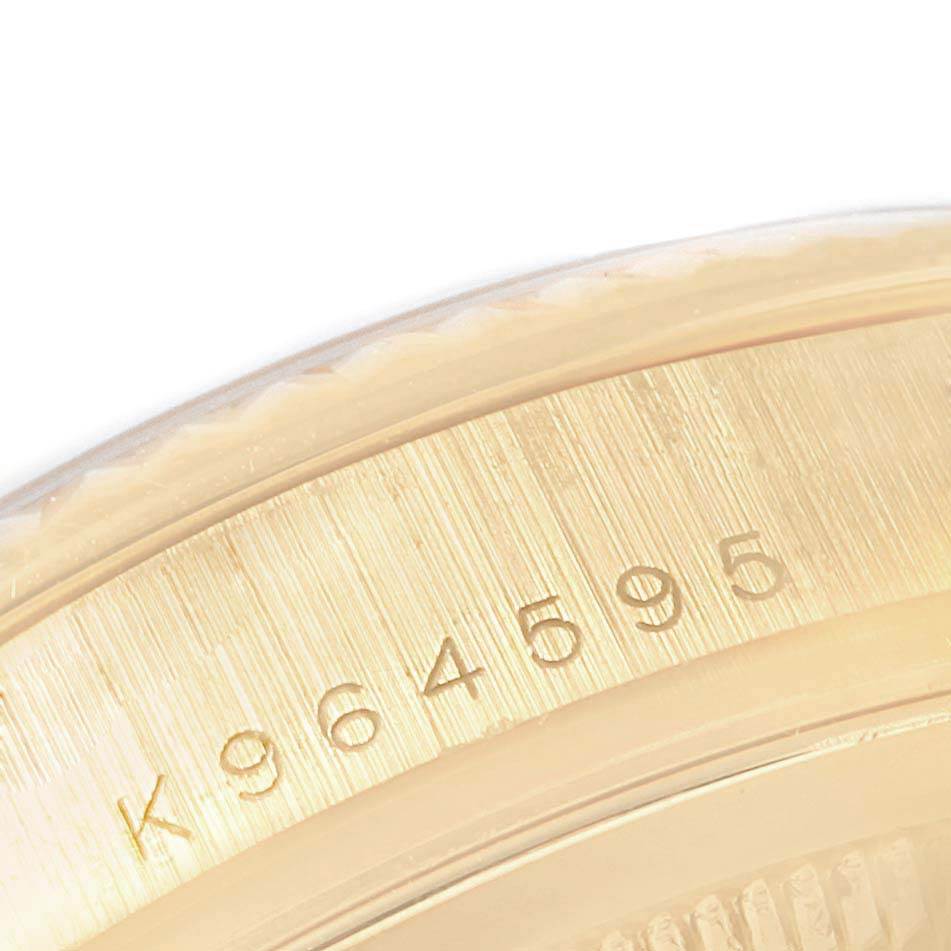 The image shows a close-up of the serial number engraved on the case back of a Rolex President 118238 Men
s Yellow Gold Champagne Dial 118238 Men
s Yellow Gold Champagne Dial model watch.