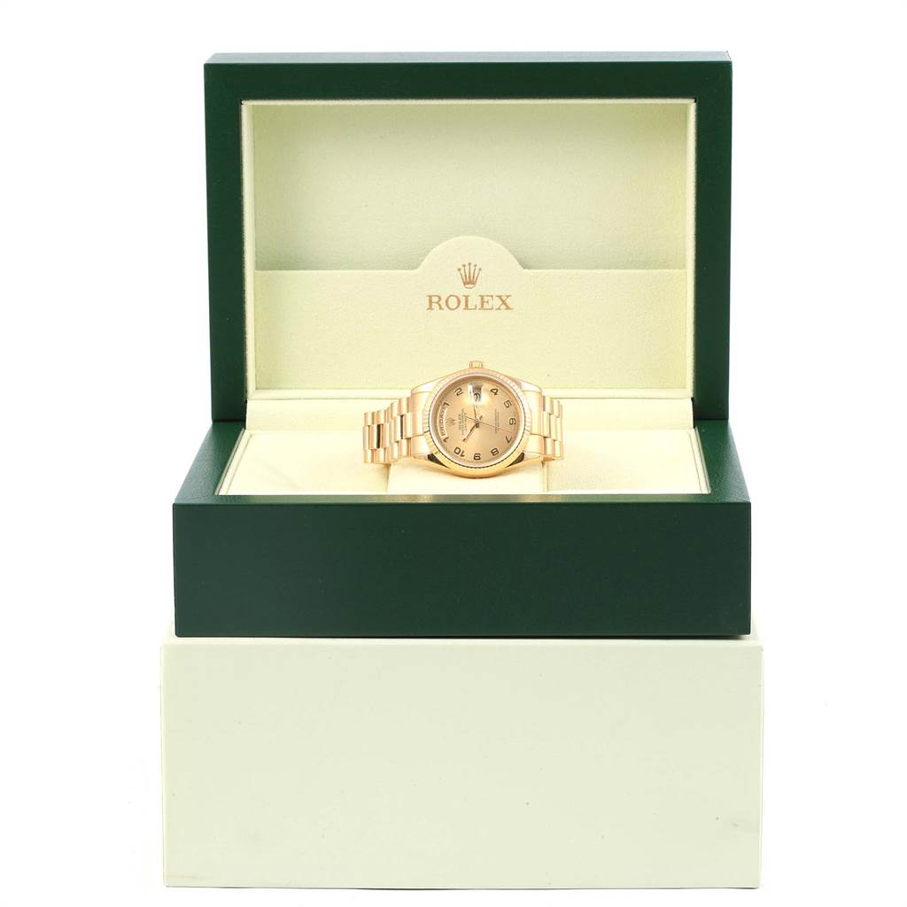 The Rolex President 118238 Men
s Yellow Gold Champagne Dial 118238 Men
s Yellow Gold Champagne Dial model watch is displayed front-on in an open green and cream box.