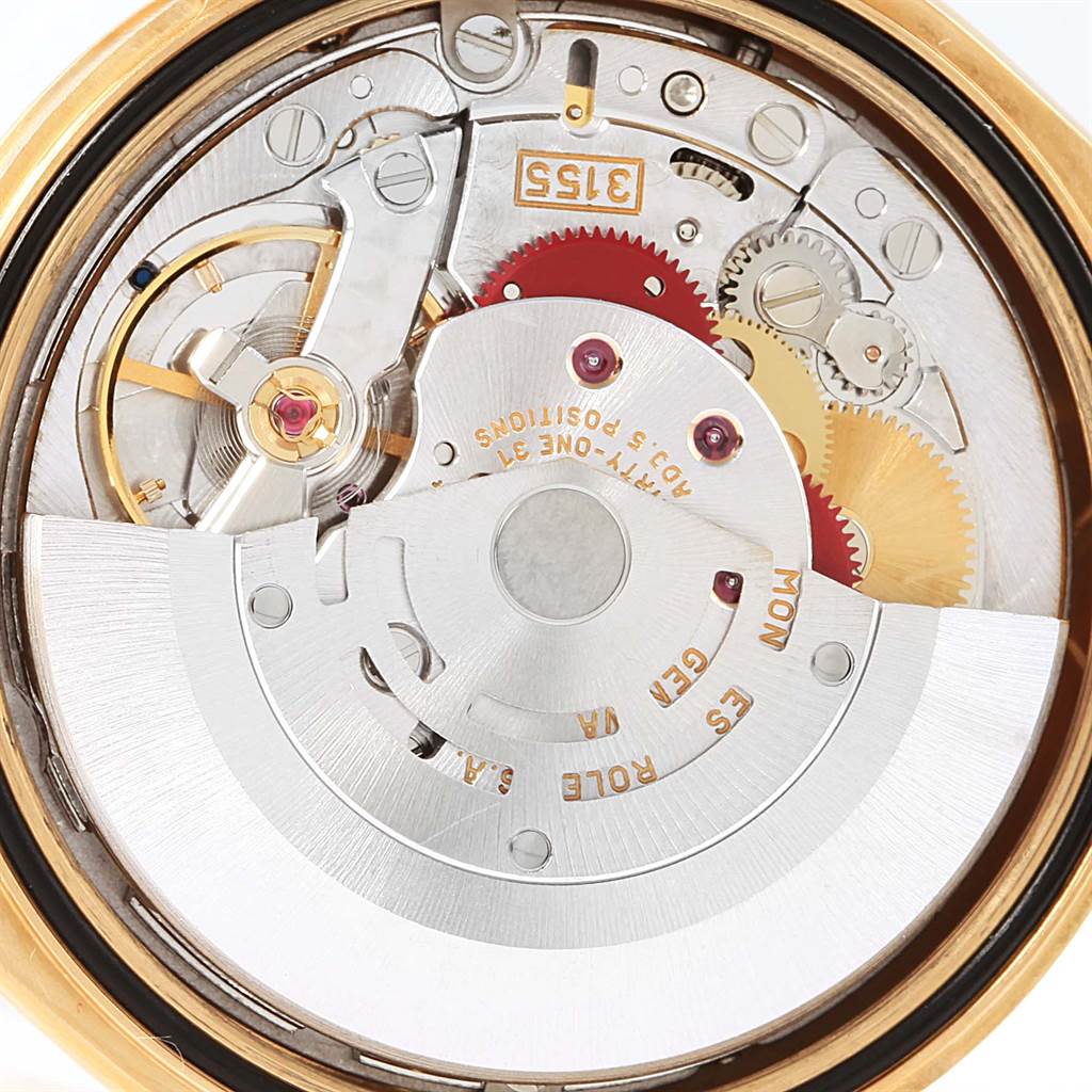 The image shows the intricate inner mechanism of a Rolex President 118238 Men
s Yellow Gold Champagne Dial 118238 Men
s Yellow Gold Champagne Dial model watch from a top-down angle, highlighting gears and components.