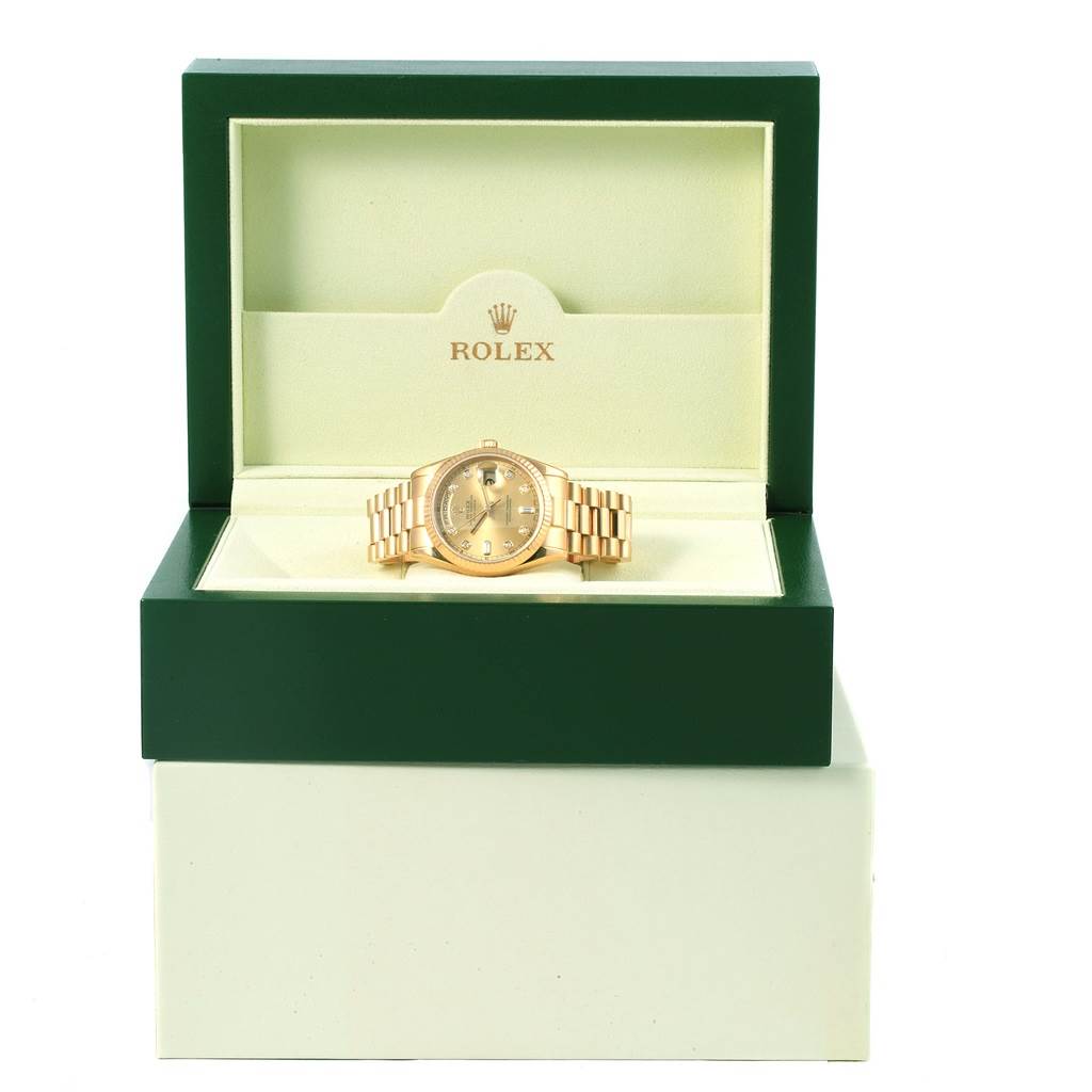 The image shows a Rolex President 118238 Men
s Yellow Gold Champagne Dial 118238 Men
s Yellow Gold Champagne Dial model watch in a partially open green and cream box from a front angle.