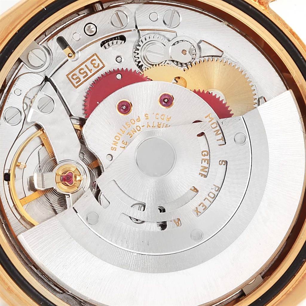 This is an angled view of the Rolex President 118238 Men
s Yellow Gold Champagne Dial 118238 Men
s Yellow Gold Champagne Dial watch movement showing the gears and inner mechanical parts.