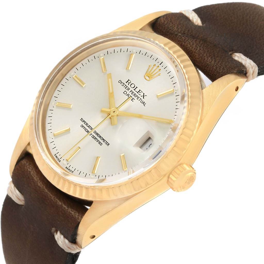 This Rolex President 15037 Men
s Yellow Gold Silver Dial 15037 Men
s Yellow Gold Silver Dial watch is shown from an angled side view, highlighting its gold case, leather strap, and dial.