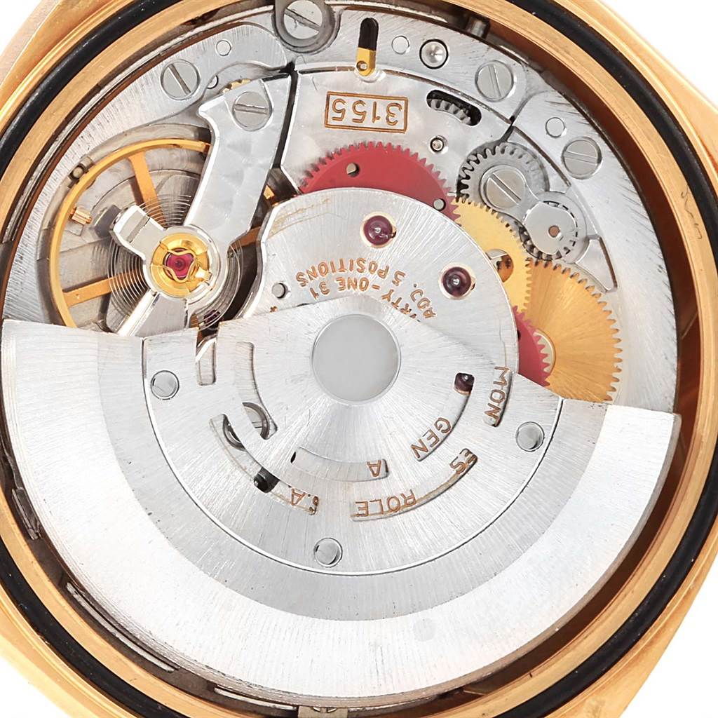 The image shows the internal mechanical components of the Rolex President 18238 Men
s Yellow Gold Champagne Dial 18238 Men
s Yellow Gold Champagne Dial model watch from an open case back angle.