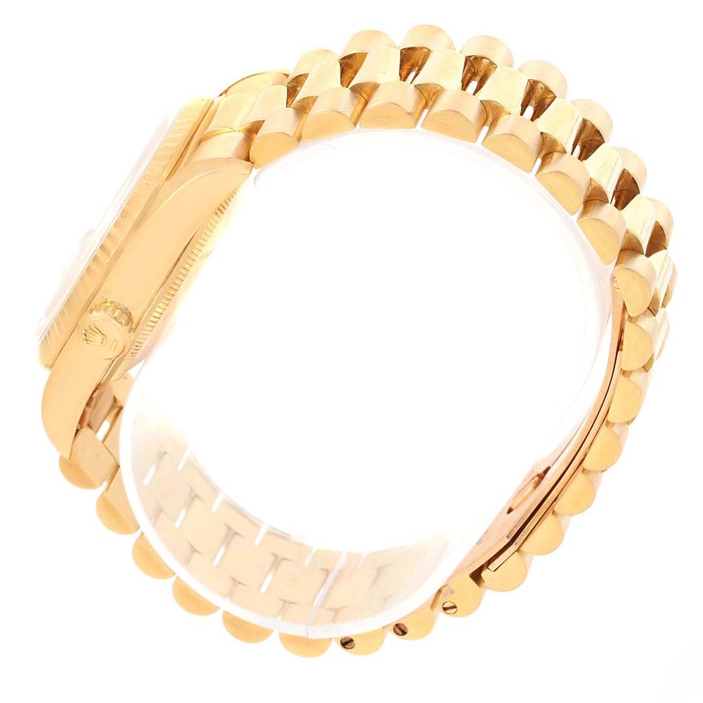 The image showcases a side view of the Rolex President 18238 Men
s Yellow Gold Champagne Dial 18238 Men
s Yellow Gold Champagne Dial model, emphasizing its gold bracelet and case.