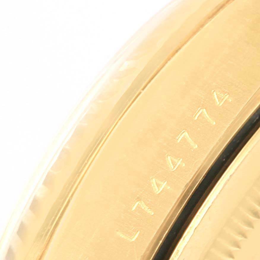 This close-up shows the bezel edge and part of the case side with serial number engraving of a Rolex President 18238 Men
s Yellow Gold Champagne Dial 18238 Men
s Yellow Gold Champagne Dial model.