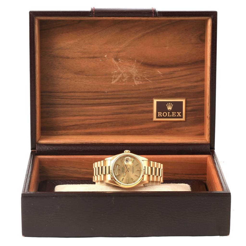 This image shows a Rolex President 18238 Men
s Yellow Gold Champagne Dial 18238 Men
s Yellow Gold Champagne Dial model watch, displayed in an open wooden Rolex box, showcasing its face and bracelet.