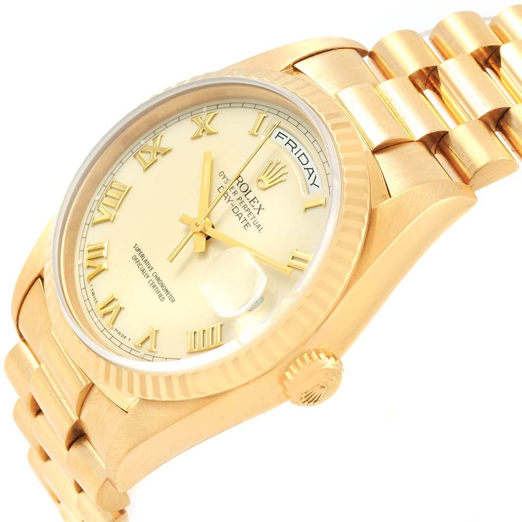 The image shows a close-up of the Rolex President 18238 Men's Yellow Gold Beige Dial 18238 Men's Yellow Gold Beige Dial model's gold bezel, dial, and bracelet at an angle highlighting the side and face.