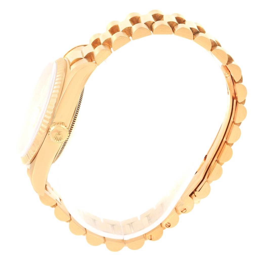 The image shows a side view of a Rolex President 18238 Men's Yellow Gold Beige Dial 18238 Men's Yellow Gold Beige Dial model watch, highlighting the case, crown, and bracelet links.