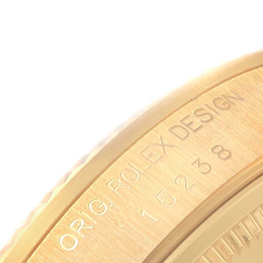 The image shows a close-up of the engraved side of a Rolex President 15238 Men
s Yellow Gold Champagne Dial 15238 Men
s Yellow Gold Champagne Dial model watch.