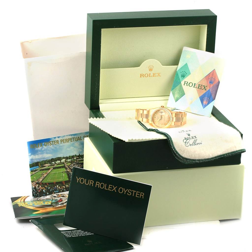 The image shows a Rolex President 15238 Men
s Yellow Gold Champagne Dial 15238 Men
s Yellow Gold Champagne Dial model watch with its original box, warranty cards, manuals, and cleaning cloth.