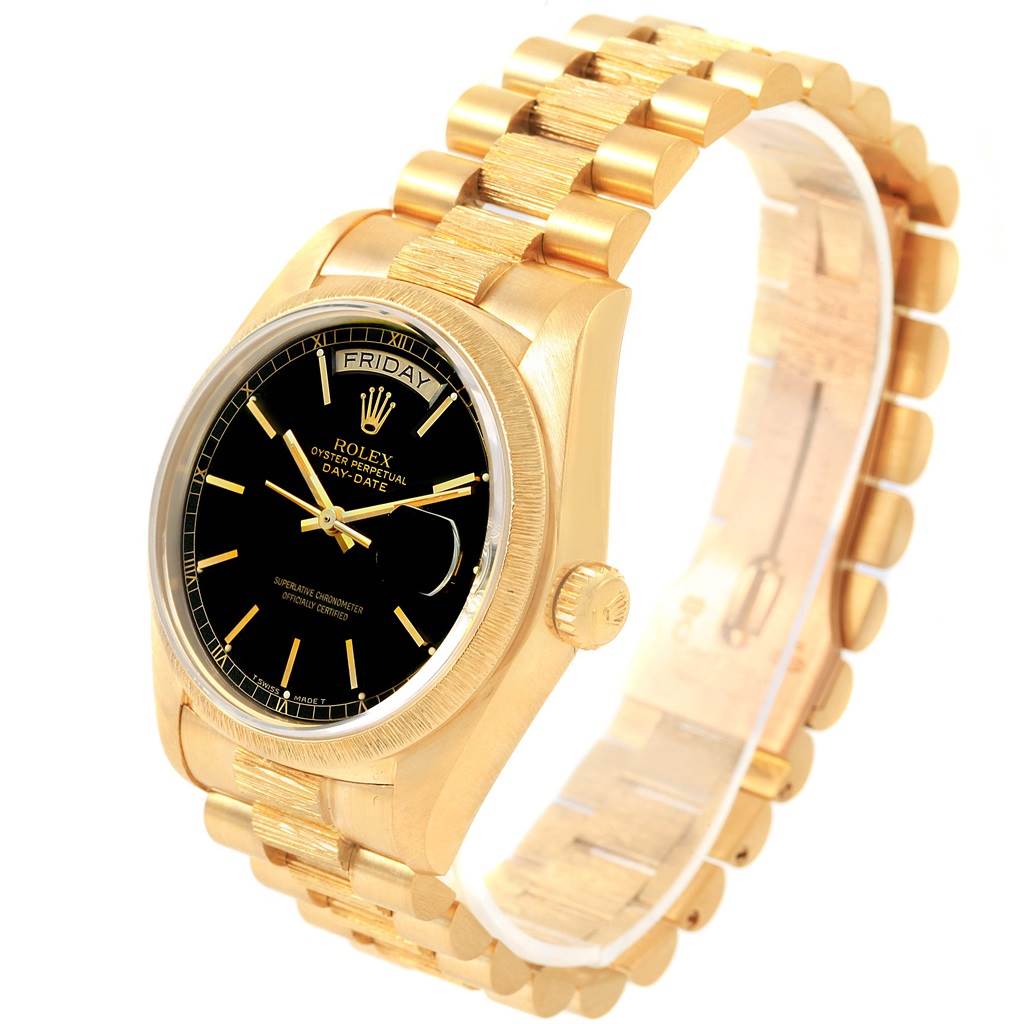 This Rolex President 18078 Men
s Yellow Gold Black Dial 18078 Men
s Yellow Gold Black Dial model watch is shown at a slight angle, highlighting its gold case, bracelet, black dial, and day-date display.