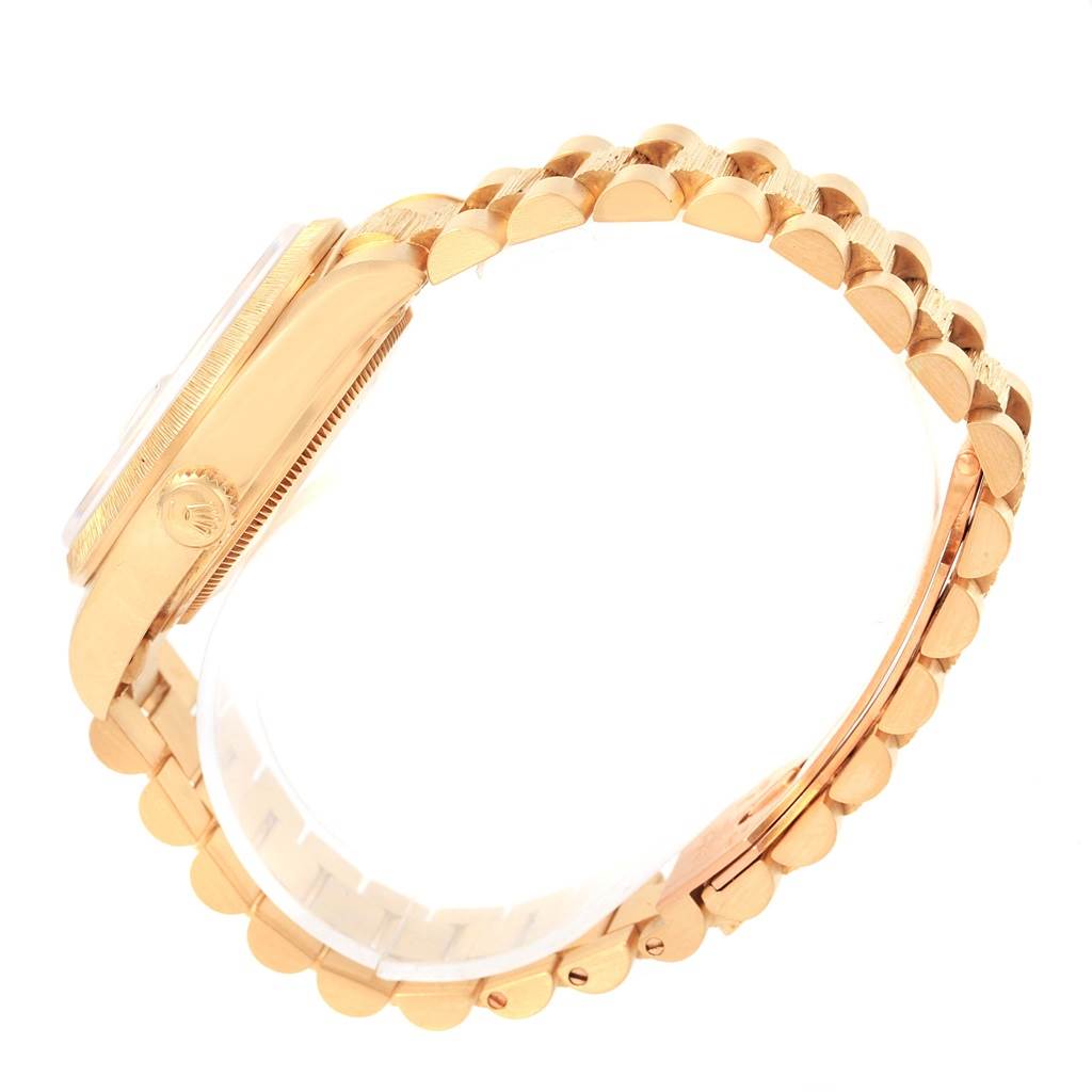 This side-view shows the case, crown, and bracelet of the Rolex President 18078 Men
s Yellow Gold Black Dial 18078 Men
s Yellow Gold Black Dial model watch.