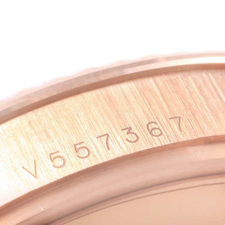 This image shows a close-up of the serial number engraved on the caseback edge of a Rolex President 218235 Men's Rose Gold Black Dial 218235 Men's Rose Gold Black Dial model watch.