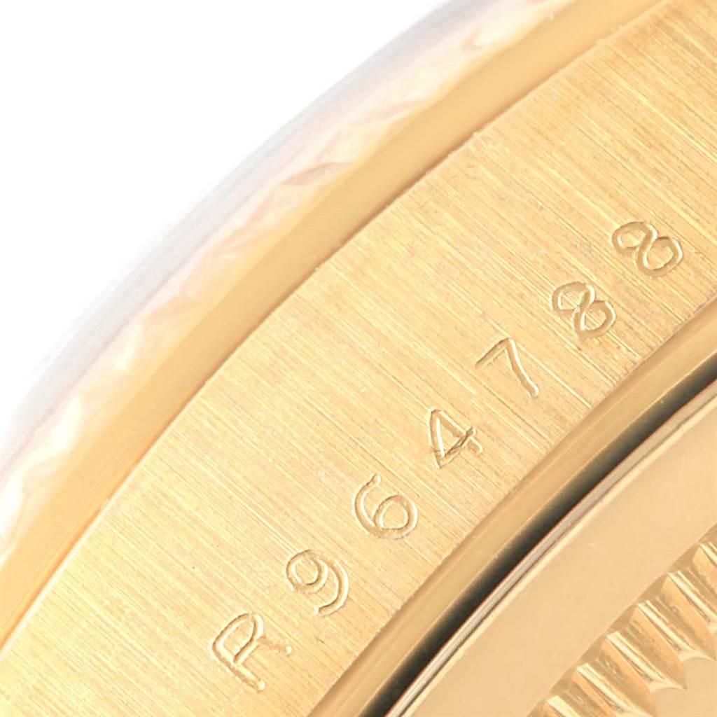 The image shows a close-up view of the side of a Rolex President 18238 Men's Yellow Gold Blue Dial 18238 Men's Yellow Gold Blue Dial model watch, highlighting the serial number engraving.