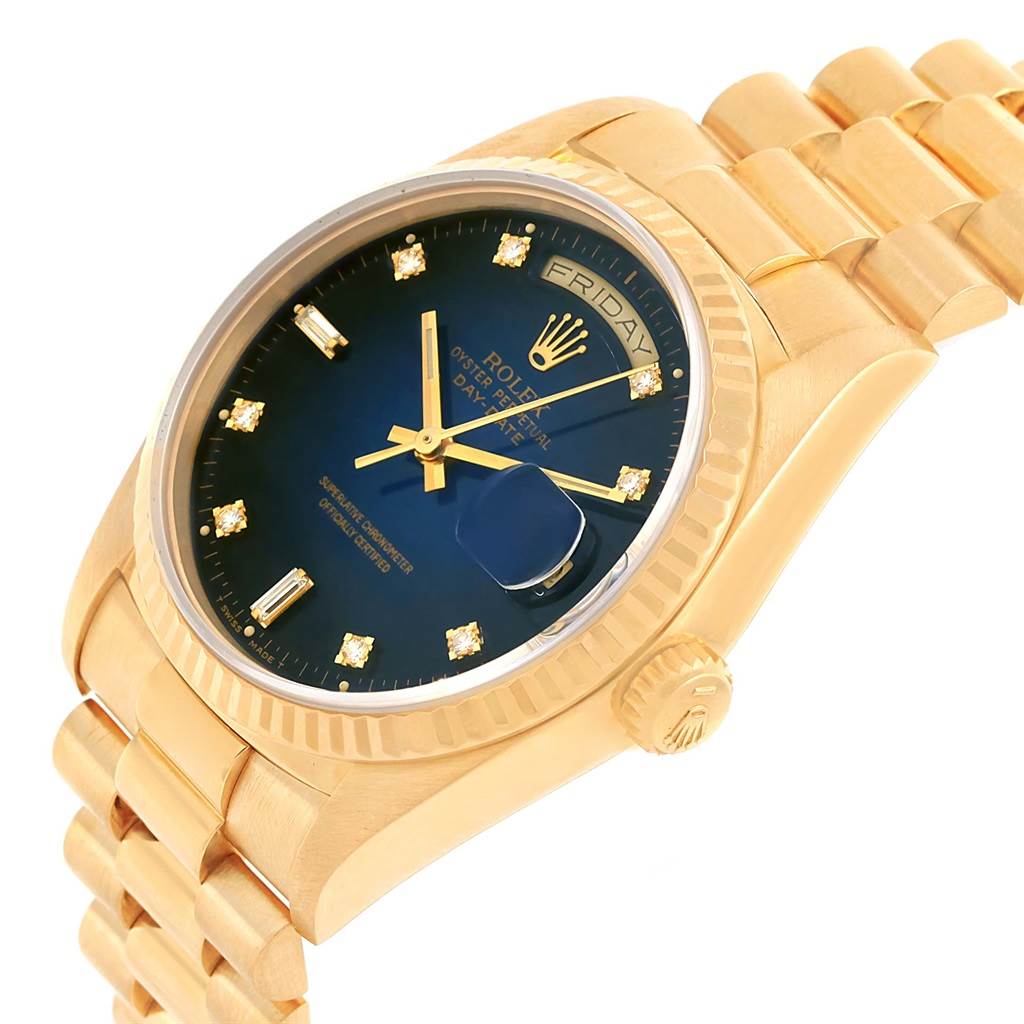 The image shows a side angle of the Rolex President 18238 Men's Yellow Gold Blue Dial 18238 Men's Yellow Gold Blue Dial model watch, highlighting the gold bracelet, crown, and blue dial with diamond markers.