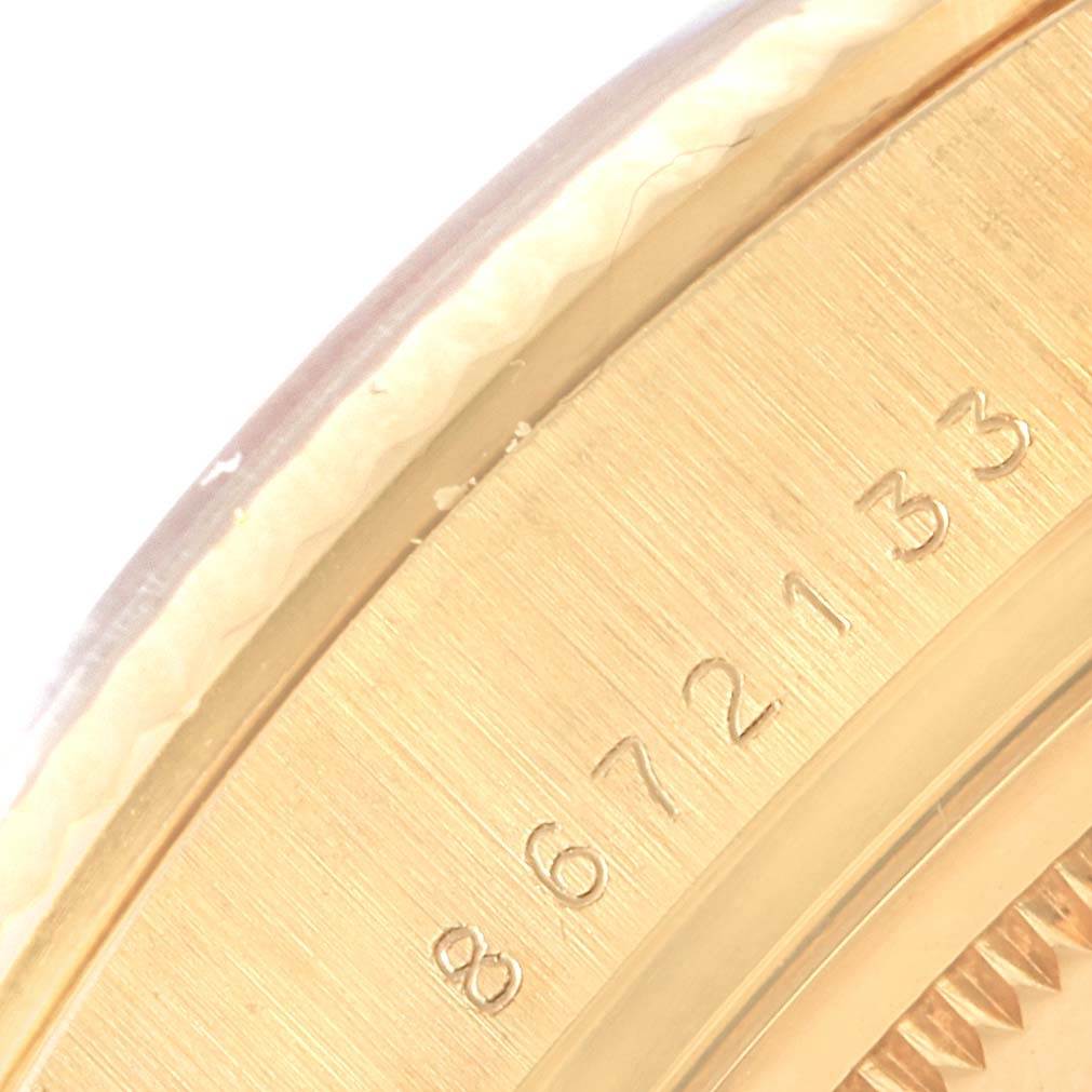 This close-up image shows the case rim and serial number engraving on a Rolex President 18038 Men's Yellow Gold Silver Dial 18038 Men's Yellow Gold Silver Dial model watch.