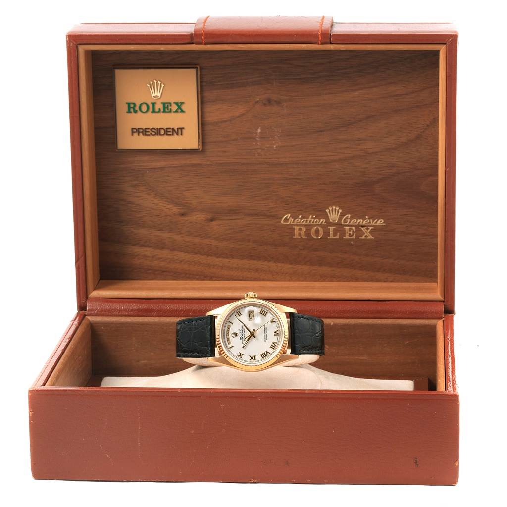 The image shows a Rolex President 18038 Men's Yellow Gold White Dial 18038 Men's Yellow Gold White Dial model watch front view in its open wooden box.