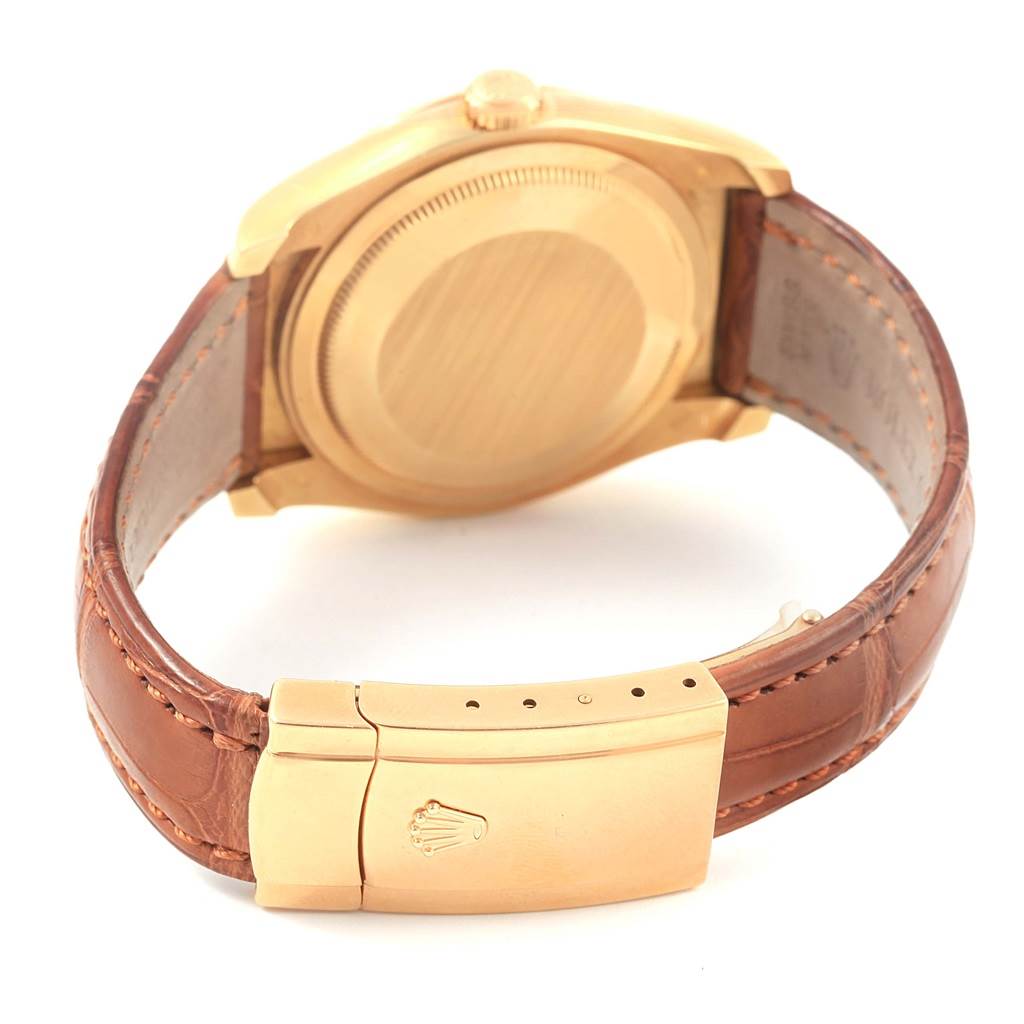 The image shows the back case and clasp of a Rolex President 116138 Men's Yellow Gold Brown Dial 116138 Men's Yellow Gold Brown Dial model with a leather strap.