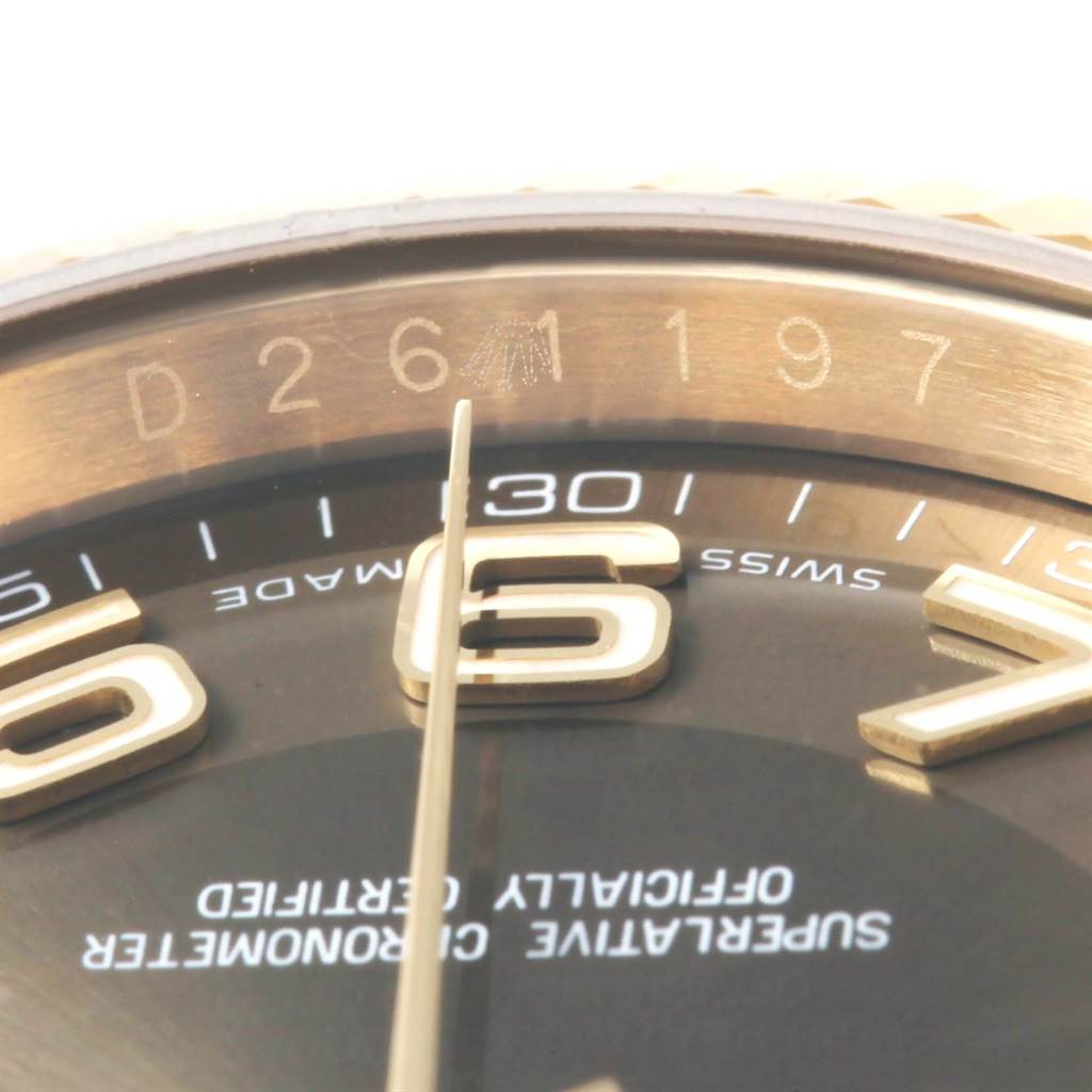 The image shows a close-up angle of the Rolex President 116138 Men's Yellow Gold Brown Dial 116138 Men's Yellow Gold Brown Dial model, highlighting the serial number, dial, and indices.