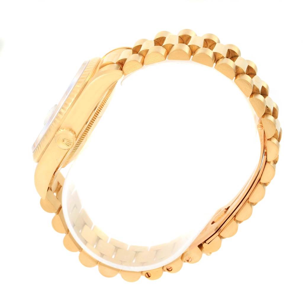 The image shows a side view of a Rolex President 18238 Men's Yellow Gold Champagne Dial 18238 Men's Yellow Gold Champagne Dial model watch, displaying its case, crown, and bracelet.