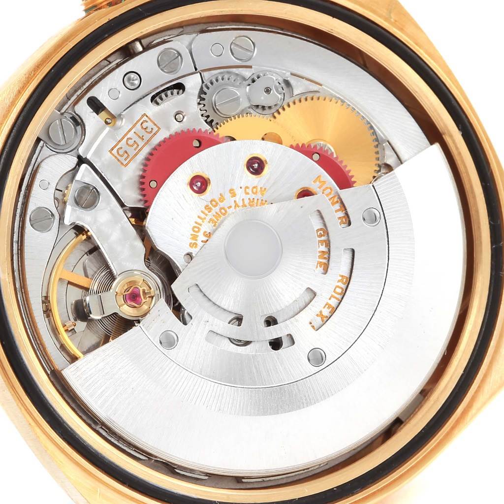This image shows the Rolex President 18238 Men's Yellow Gold Champagne Dial 18238 Men's Yellow Gold Champagne Dial model's movement from a back angle, highlighting intricate gears and components.