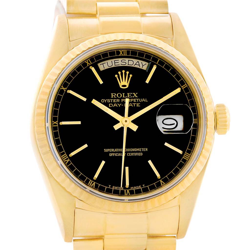 The image shows a front view of a Rolex President 18038 Men's Yellow Gold Black Dial 18038 Men's Yellow Gold Black Dial model watch, displaying its black dial, gold case, and day/date indicators.