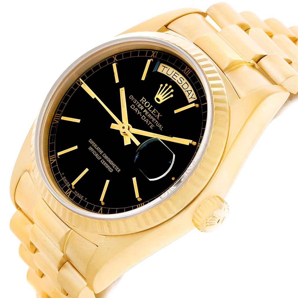 This image shows a Rolex President 18038 Men's Yellow Gold Black Dial 18038 Men's Yellow Gold Black Dial model watch at an angle that highlights the face, crown, and part of the bracelet.