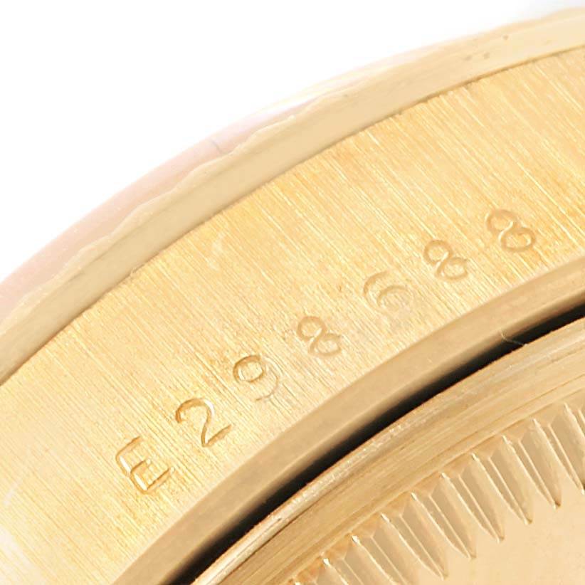 This close-up image shows the bezel and part of the case of a Rolex President 15238 Men
s Yellow Gold White Dial 15238 Men
s Yellow Gold White Dial model watch.