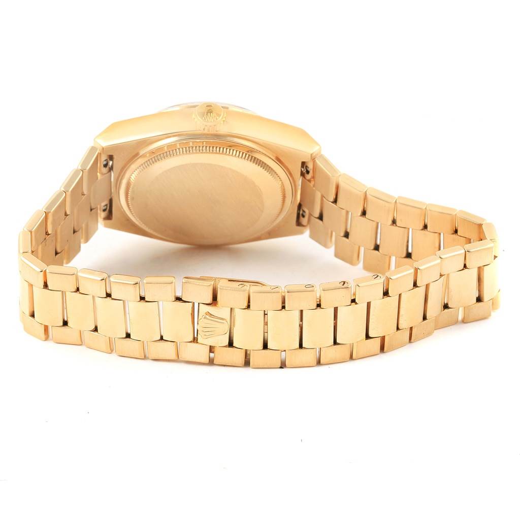 The image shows the rear view of a Rolex President 19018 Men
s Yellow Gold Black Dial 19018 Men
s Yellow Gold Black Dial model watch, focusing on the case back and the bracelet with the clasp.