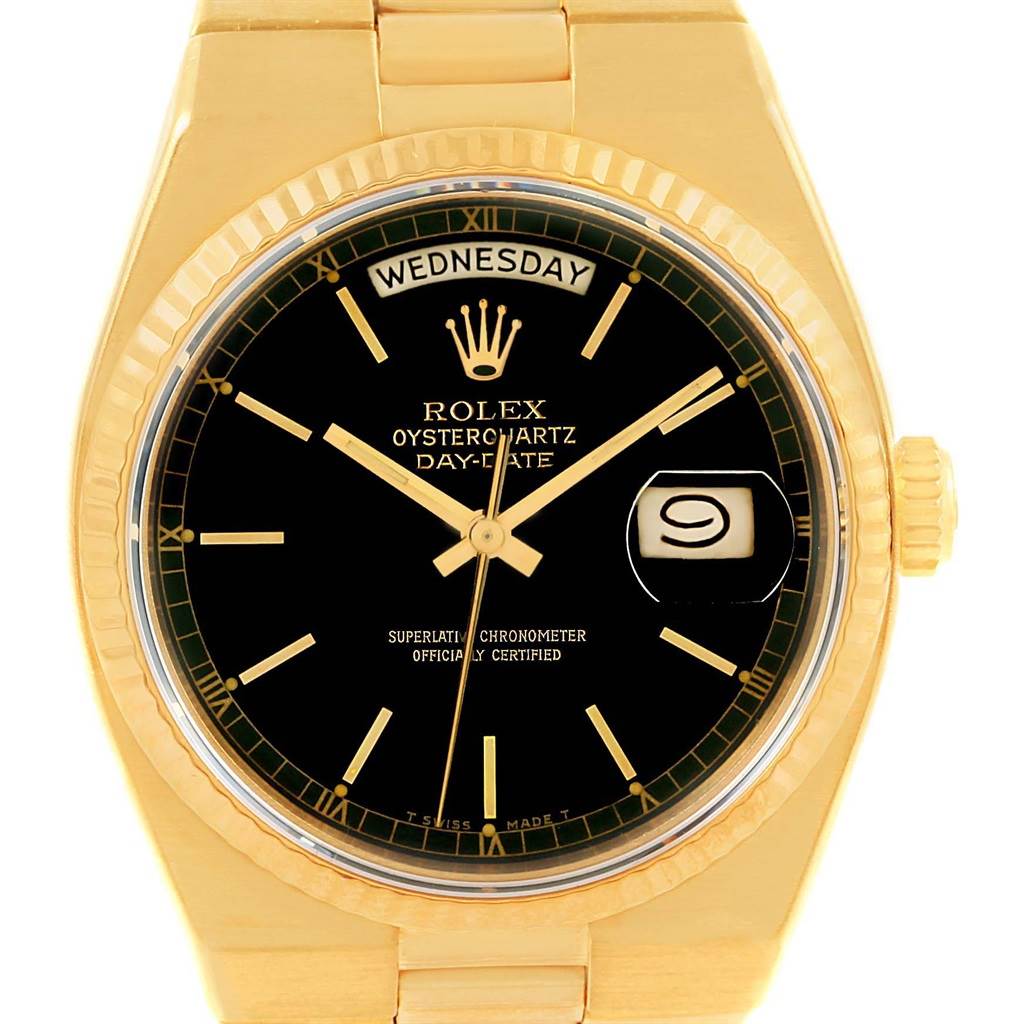 The image shows a front angle view of the Rolex President 19018 Men
s Yellow Gold Black Dial 19018 Men
s Yellow Gold Black Dial Day-Date Oysterquartz watch, highlighting the dial, day-date display, and bezel.