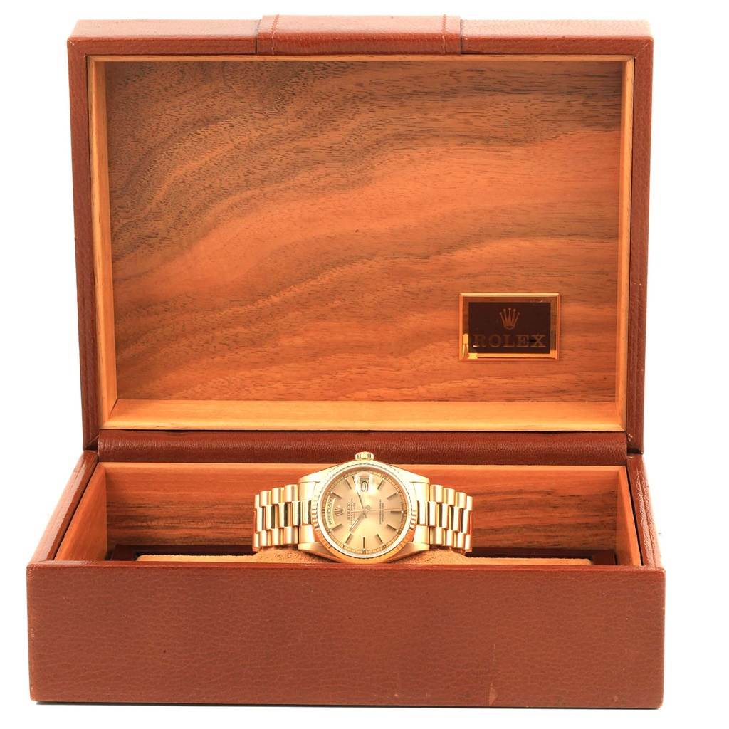 This image shows a Rolex President 18238 Men's Yellow Gold Champagne Dial 18238 Men's Yellow Gold Champagne Dial model watch in a display box, viewed from the front.