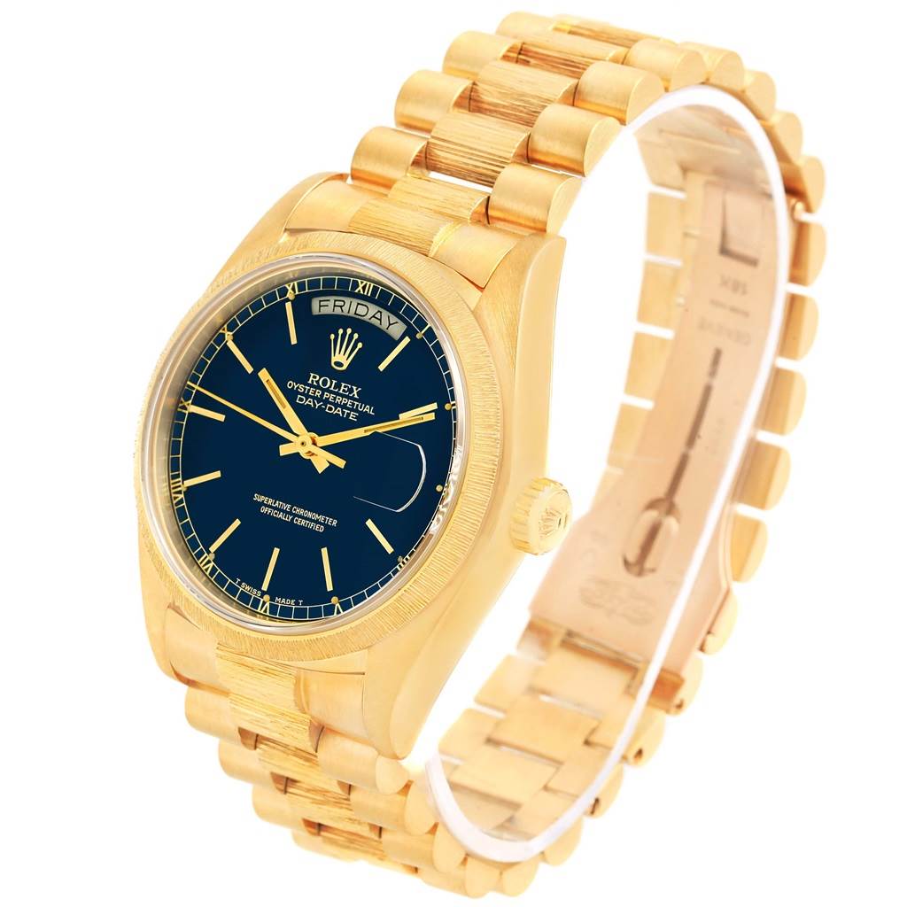 The image shows a front angle of a gold Rolex President 18078 Men
s Yellow Gold Blue Dial 18078 Men
s Yellow Gold Blue Dial model watch, including its face, band, and crown.