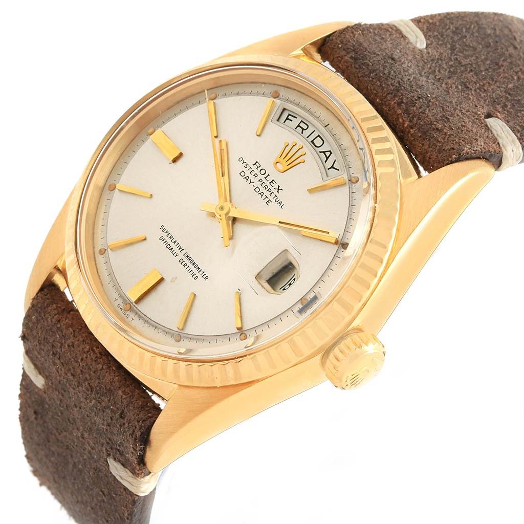 The Rolex President 1803 Men's Yellow Gold Silver Dial 1803 Men's Yellow Gold Silver Dial model watch is shown at a three-quarter angle, highlighting the dial, fluted bezel, and part of the leather strap.