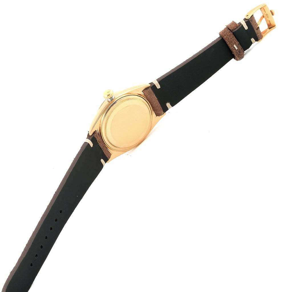 This image shows the back and strap of a Rolex President 1803 Men's Yellow Gold Silver Dial 1803 Men's Yellow Gold Silver Dial model watch, highlighting the gold case and leather strap.