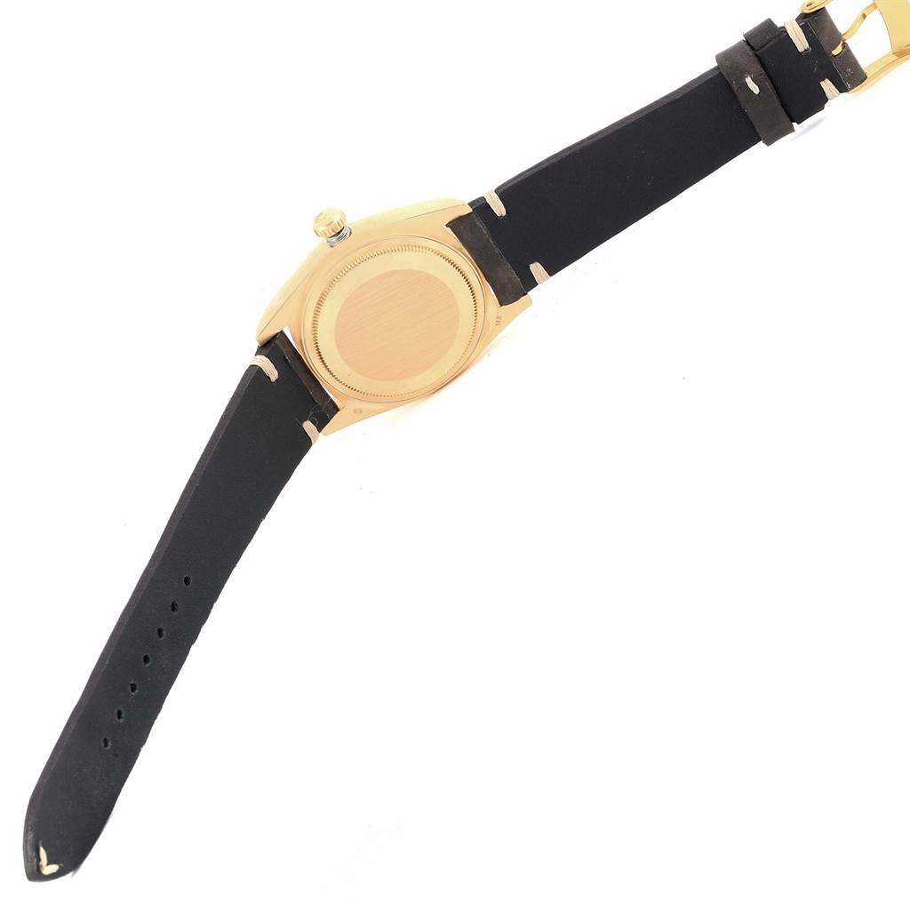 The image shows the back and strap of a Rolex President 18038 Men
s Yellow Gold Champagne Dial 18038 Men
s Yellow Gold Champagne Dial model watch from an oblique rear angle.