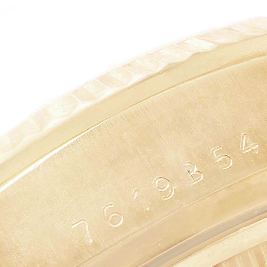 The image shows a close-up of the serial number engraved on the case back of a Rolex President 18038 Men
s Yellow Gold Champagne Dial 18038 Men
s Yellow Gold Champagne Dial model watch.