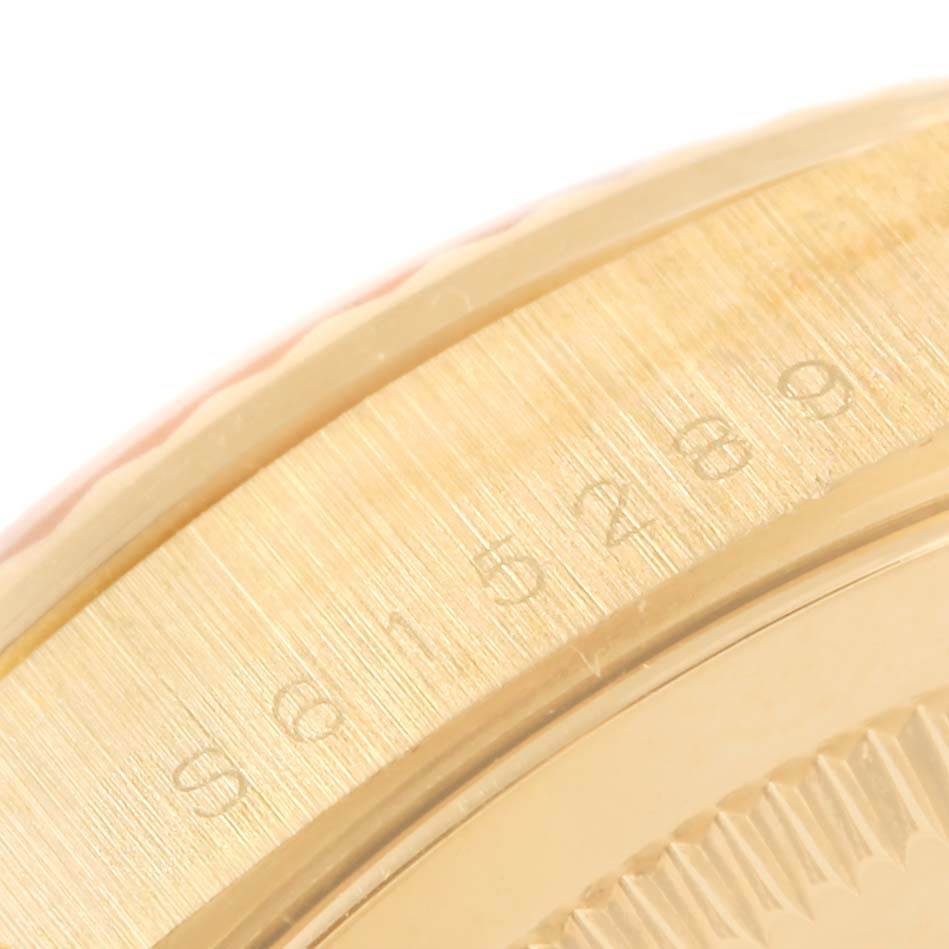 This close-up image shows part of the bezel and case of the Rolex President 18238 Men's Yellow Gold Champagne Dial 18238 Men's Yellow Gold Champagne Dial model watch.