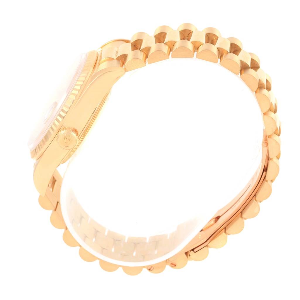 The image shows a side view of the Rolex President 18238 Men's Yellow Gold Champagne Dial 18238 Men's Yellow Gold Champagne Dial model watch highlighting the gold case, crown, and bracelet.