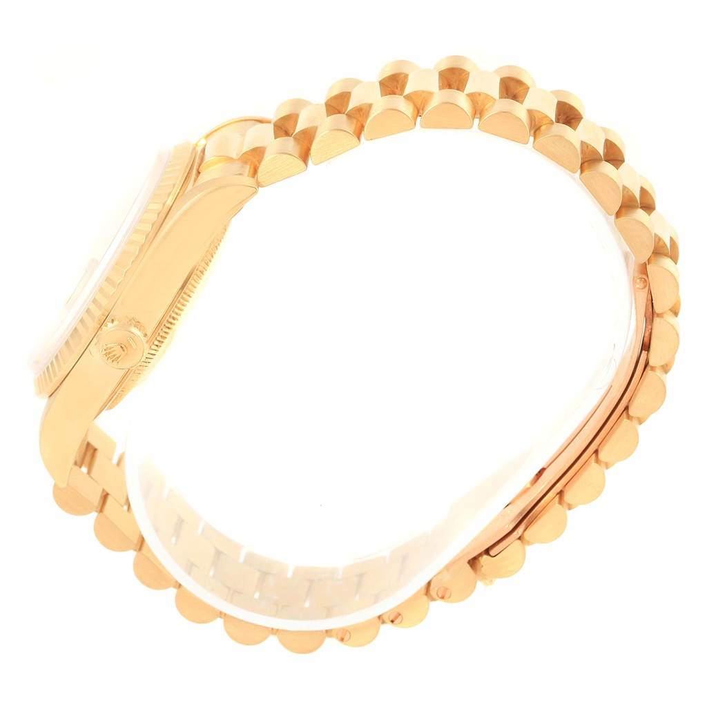 This image shows a side angle of the Rolex President 18238 Men
s Yellow Gold Champagne Dial 18238 Men
s Yellow Gold Champagne Dial watch, highlighting its crown, case, and bracelet band.