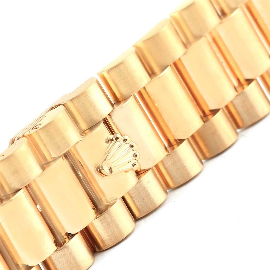 The image shows a close-up of the gold bracelet clasp with logo of a Rolex President 18238 Men
s Yellow Gold White Dial 18238 Men
s Yellow Gold White Dial watch.